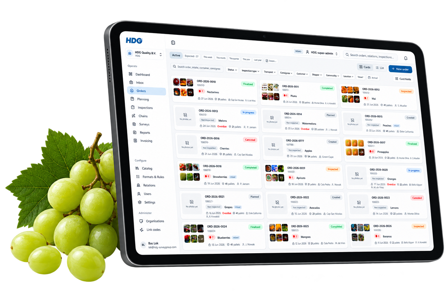 QC4U orders overview on a tablet next to fresh green grapes